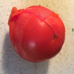 skin easily peels away from blanched tomato