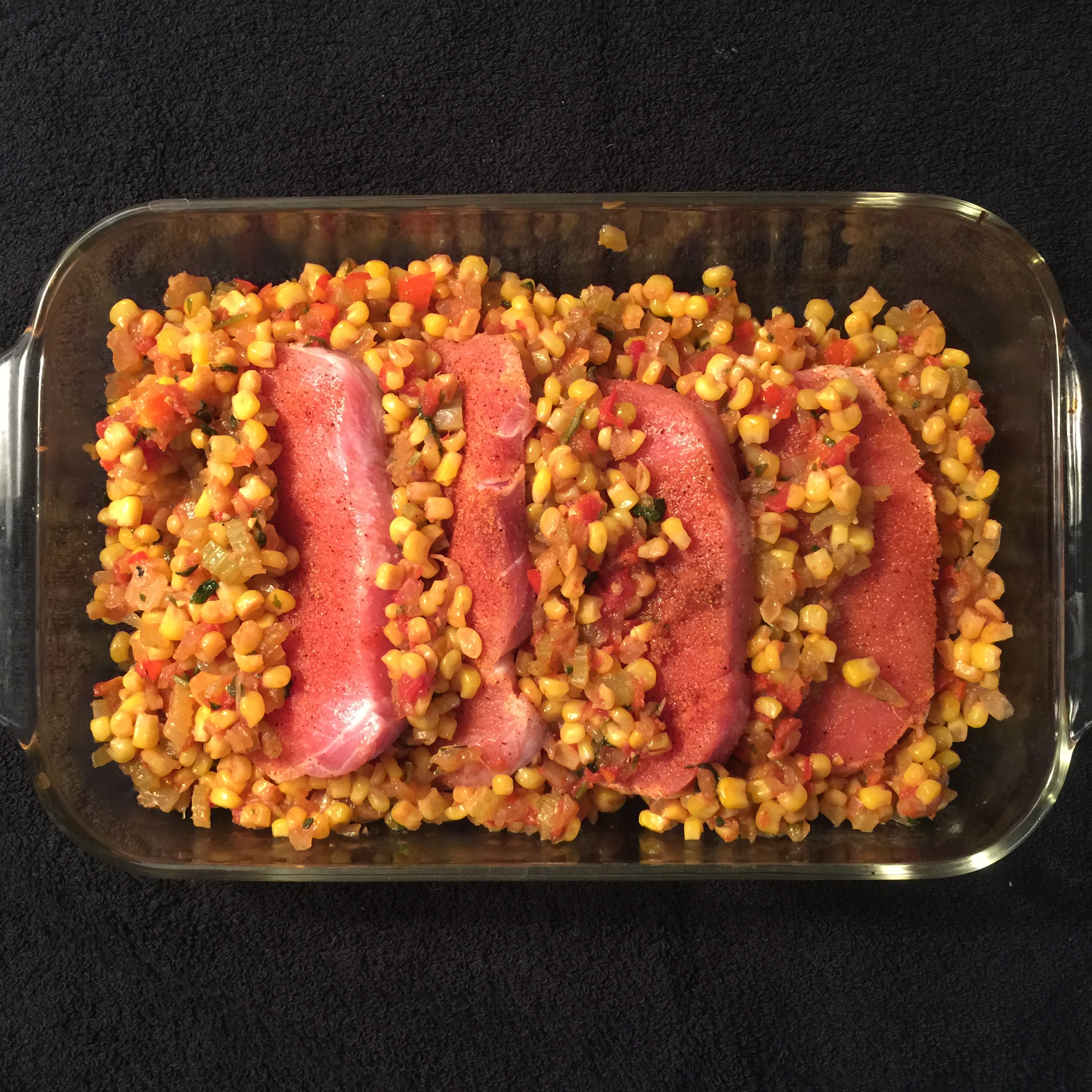 arrange in baking dish overlapping pork and Maque Choux, cover with foil and bake according to directions